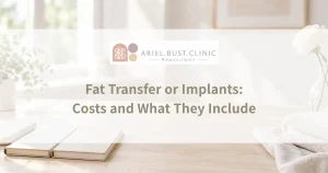 Two open notebooks beside folded cream towels and a glass vase on a sunlit desk, arranged for comparing breast augmentation budgets.